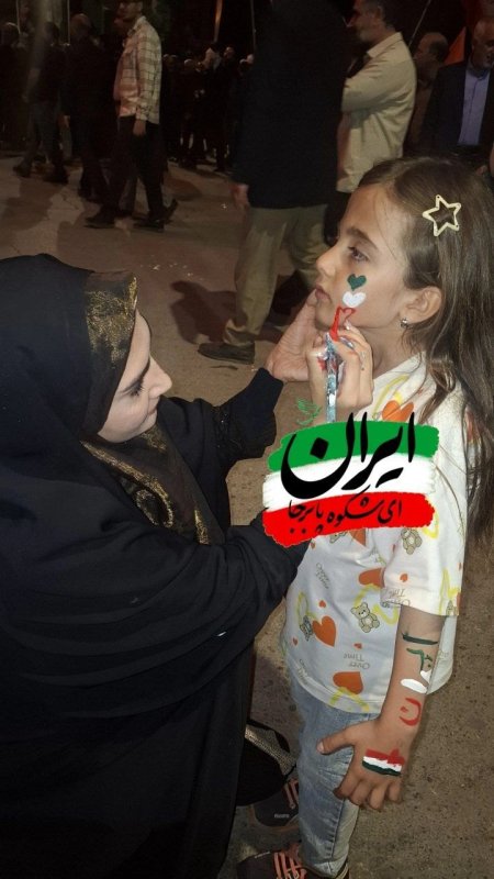 نقاشی پرچم روی صورت کودکان